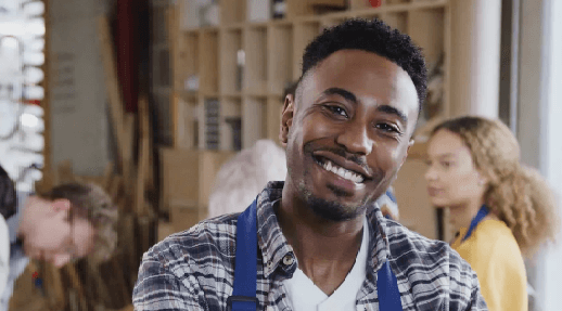 Young Black man smiling at camera